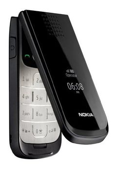 an old nokia cell phone is open and showing the keypad on it's side