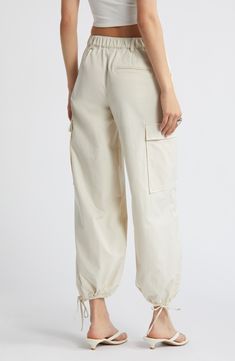 Drawstring ankle-length hems add versatility to these utilitarian cargo pants fashioned with recycled fibers. 28" inseam; 14" leg opening; 11 1/2" front rise; 13 1/2" back rise (size medium) Zip fly with button closure Front slant pockets; cargo flap-patch pockets Drawstring ankle hems 65% recycled polyester, 35% polyester Machine wash, tumble dry Imported Utility Ankle-length Cargo Pants, Cream Wide Leg Cargo Pants, White Ankle-length Cargo Pants With Pockets, Utility Cotton Cargo Pants With Cuffed Ankles, Beige Parachute Pants With Tapered Leg And Side Pockets, Beige Spring Cargo Pants With Multiple Pockets, Beige Cargo Jeans With Cargo Pockets For Spring, Spring Beige Cargo Pants With Patch Pockets, Beige Cargo Pants With Multiple Pockets For Spring