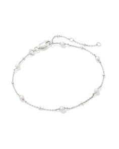 Why go for one pearl, when you could have a whole strand of them? The Emmaline Sterling Silver Delicate Chain Bracelet in White Pearl combines heirloom-quality metal and dainty cultured freshwater pearls to create a minimal essential made to match with everything—and last through every season. Metal Sterling Silver Why Sterling Silver? Our Sterling Silver collection features elevated styles to wear time and time again. With a base of both pure silver and copper, Sterling Silver provides a precious yet affordable option that offers long-lasting wear and shine and is the perfect addition to your Demi-Fine jewelry rotation. Learn More About Metals & Care Material White Pearl Closure Lobster Clasp Size 6.5" With 2" ExtenderDue to the one-of-a-kind nature of the medium, exact colors and pattern Silver Bracelets Dainty, Kendra Scott Bracelet Silver, Silver Dainty Bracelets, Dainty Silver Bracelets, Cute Silver Jewelry, Pretty Silver Jewelry, Pearl Bracelet Silver, Burr Basket, Silver Bracelet Stack