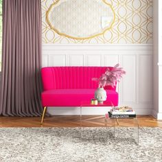 a living room with a pink couch and gold wallpaper, along with a rug on the floor