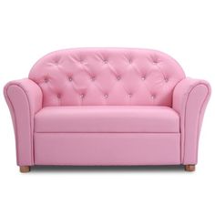 a pink couch sitting on top of a white floor