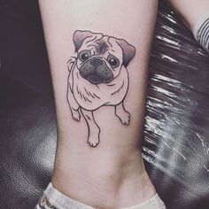 a small pug dog tattoo on the right side of the leg, it is black and white