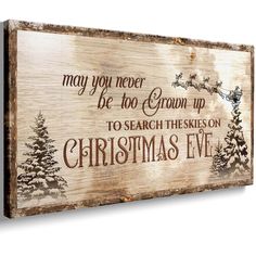 a wooden sign that says, may you never be too grown up to search the skies on christmas eve