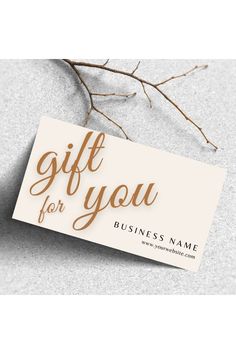 a business card with the words gift for you on it and a branch in front