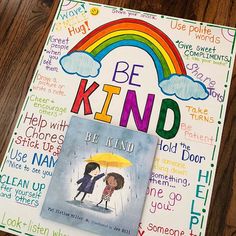 a children's book with the words be kind written on it and an umbrella