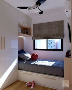 a small bedroom with a bed and window