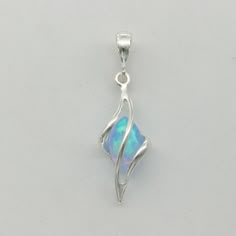 This is a simulated Fire Opals Pendant in 925 Sterling Silver.  Rhodium makes the silver not tarnish. The metal also is without any nickel or other substances which usually are the reason for most allergies. This makes the jewelry hypo allergenic. Size of the Pendant (incl. Bail) 3.1 x 1.0 cm 1.22 x 0.39 inch You will receive the item in a gift box - perfect to surprise someone or yourself. Usually we ship on the same day we receive the payment for the order. Oc Accessories, Angel Oc, Blue Pendant Necklace, Pretty Crafts, Fire Opals, Blue Fire Opal, Magical Jewelry, Blue Pendant, Dope Jewelry