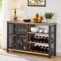 a wine rack with bottles and glasses on it in front of a wall mounted painting