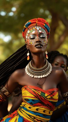 an african woman in colorful dress and headdress, with braids on her hair