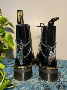 Lunar Lotus Boot Chains are the perfect way to spice up your Doc Martens or Combat Boots!  The chain length fits both Platform and Classic heel heights - Each order comes with a set of two chains of the same style - Each set is handmade. *New* Heavy Gauge Chains with detachable charms for easy mixing and matching! This Set Includes: - 2 Silver Butterfly Wing Charms (Detachable) - Clips: 14mm Silver Plated - Chain: Nickle - Fittings: Silver Plated Boot Chains, Wrap Boots, Classic Heels, Butterfly Wing, Star Gift, Silver Butterfly, Shoe Clips, Doc Martens, Butterfly Wings