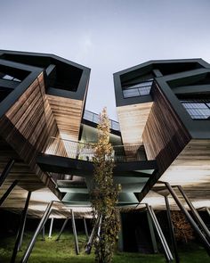 an unusual building with multiple floors and balconies