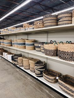 baskets are lined up on shelves in a store