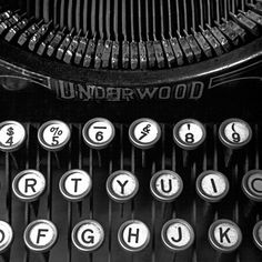 black and white photograph of an old fashioned typewriter with the words underwood written on it