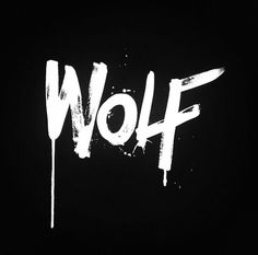 the word wolf is painted in white on a black background