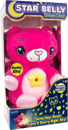 a pink teddy bear with stars on its chest