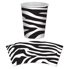 a zebra print cup and napkins on a white background with the image of a black and white pattern