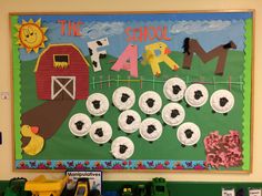 a bulletin board with paper plates and farm animals on it