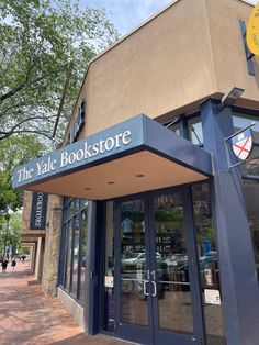 the front entrance to the book store is blue and has large doors that lead into it