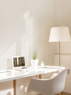 a white desk with a laptop on it and a lamp in front of the table