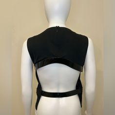 This Stunning Black Backless Top From Tom Ford's Gucci Collection Is A Must-Have For Any Fashion-Forward Woman. The Sleek Tank Design Features A Backless Design And Is Made From High-Quality Materials That Will Last For Years To Come. Perfect For A Night Out Or A Special Occasion, This Top Is Sure To Turn Heads With Its Unique Design And Stunning Backless Feature. Available In Size M, This Top Is Perfect For Women Of All Shapes And Sizes. So Why Wait? Add This Beautiful Tom Ford For Gucci Top To Your Wardrobe Today And Elevate Your Style To The Next Level. Measurements Shoulders: 13” Bust: 34” Waist: 27” Designer Black Top For Evening, Elegant Fitted Gucci Tops, Luxury Black Evening Tops, Gucci Fitted Formal Top, Formal Fitted Gucci Top, Designer Sleeveless Tops For Evening, Designer Black Tops For Night Out, Gucci Luxury Formal Tops, Gucci Black Top For Night Out