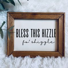 a wooden framed sign that says, blessing this hizzle for people on the floor