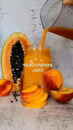 peach papaya juice being poured into a jar