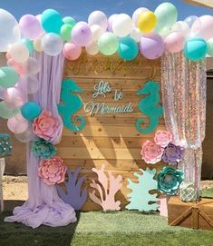 a mermaid themed birthday party with balloons and decorations