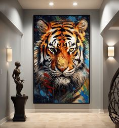 a large tiger painting hanging on the wall in a room with a vase and lamp