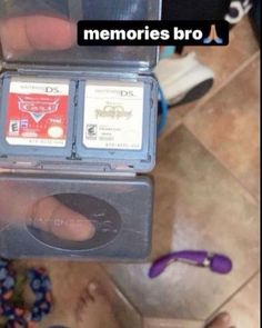 someone is holding two video game cartridges in their hands, with the words memoryies bro written on them