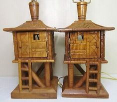 two wooden lamps sitting on top of each other