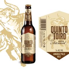 a bottle of beer next to a label for quintoto torro, with an image of a dragon on it