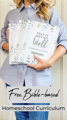 a woman holding a book with the title, that it may go well free bible - based homeschool curriculum