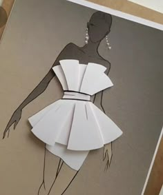 a paper cut out of a woman's dress