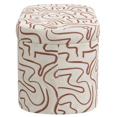 a white and brown stool with wavy lines on it