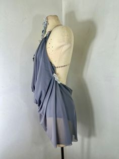 a mannequin with a dress on it's head