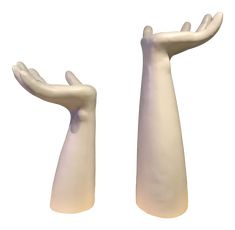 two white hands are holding each other in the air