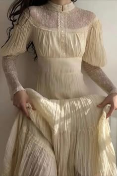 This Modest Yellow Lace Bridal Dress Long Sleeve is a Victorian wedding dress that is inspired by the Gunne Sax style. The dress features a high neckline, a corseted waist, and a flared skirt. The dress has a natural color lace fabric with a subtle yellow hue that is perfect for a Victorian wedding. White Dress Long Sleeve, Victorian Lace Dress, Duck Yellow, White Dress Long, Victorian Wedding Dress, Modest Neckline, Max Dress, Yellow Tea, Sax Dress