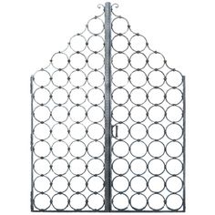 an iron gate with circles on the top and bottom, is shown in front of a white background