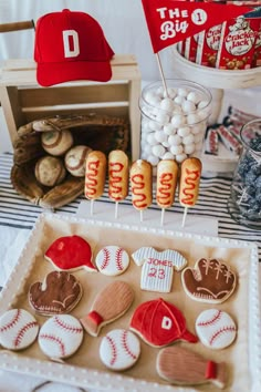 baseball themed desserts are displayed on a table