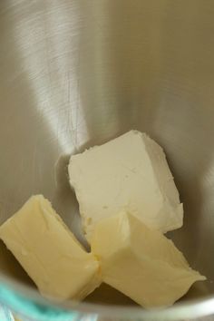 cubes of butter sit in a metal bowl