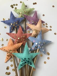 five star shaped hair pins with sequins on them, all in different colors