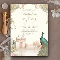 the peacock is standing in front of the wedding card