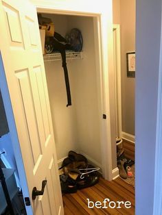 an open closet door with shoes on the floor