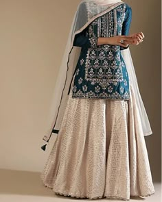 Sharara Suit for wedding occasions DM us for orders and more info 💌 Short Kameez With Sharara, Sharara Skirt Designs, Short Top And Sharara, Pakistani Bridal Suits Salwar Kameez, Cream Sharara Suit, Short Kurti Sharara Suit, Short Kurti With Skirt Indian, Short Kurti With Skirt Party Wear, Sharara Designs For Plus Size