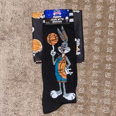 Space Jam A New Legacy Bugs Bunny Crew Socks With Bandana. Men’s Size 6-12 Crew Sock Featuring Bugs Bunny Twirling A Basketball On His Finger. The Bottom Of The Sock Says Tune Squad. Socks Are 98% Polyester, 2% Spandex. Bandana Is 100% Polyester. One Size Fits Most. Bugs Bunny Socks, Bandana Men, Space Jam A New Legacy, Bandana Colors, Tune Squad, Crew Sock, A Basketball, Space Jam, Bugs Bunny