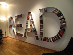 the letters are made out of books on the wall