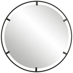 a round mirror with black trim around it