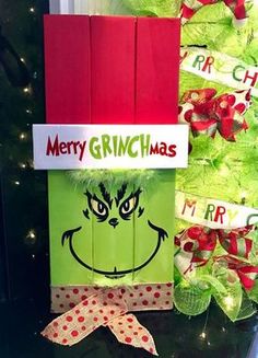 an image of a christmas present wrapped in green paper with the grin face on it