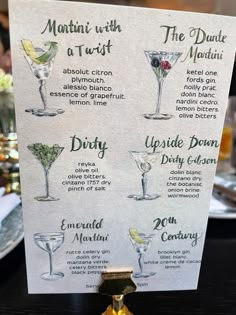 a menu with drinks on it sitting on a table