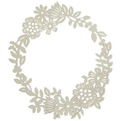 a paper wreath with flowers and leaves cut out on it's sides, in the shape of a circle